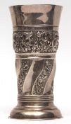 Victorian beaker shaped vase with flared rim and embossed and girdled body on spreading circular