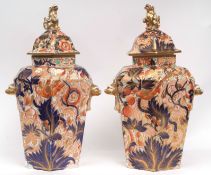 Impressive pair of early 19th century English Porcelain floor vases and covers with lion mask
