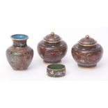 Four pieces of Japanese cloisonne enamel comprising a pair of jars and covers, a vase and a napkin