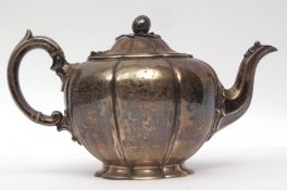 Victorian melon shaped tea pot of typical lobed form with cast and applied finial on a shaped