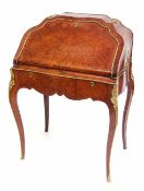 Louis XV style gilt metal mounted kingwood desk of shaped arched form, the fall front enclosing a