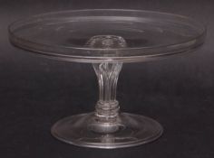 18th century glass tazza of circular form with raised rim over a wrythen moulded base and