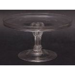 18th century glass tazza of circular form with raised rim over a wrythen moulded base and