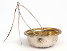 George IV gilt lined silver tea strainer of circular form with applied rim and pierced gilt lined