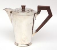 George VI hot water pot, in the Art Deco manner, with hinged cover, tapering polished body and