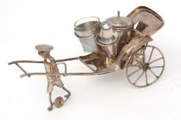 Far Eastern white metal novelty cruet set modelled in the form of a rickshaw carriage and driver and