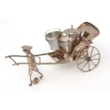 Far Eastern white metal novelty cruet set modelled in the form of a rickshaw carriage and driver and