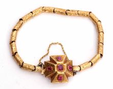 Victorian gold and ruby bracelet, a design of engraved hollow tubular links to an engraved Maltese