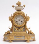 Late 19th century French gilt brass and alabaster mantel clock, the arched case surmounted by a