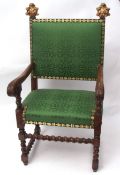 19th century throne chair, two uprights decorated with gilded foliate and c-scroll mounts, green