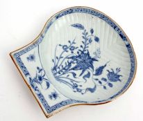 18th century Chinese porcelain scallop moulded dish decorated with flowering plants within a cell