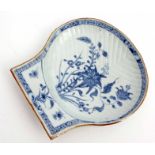 18th century Chinese porcelain scallop moulded dish decorated with flowering plants within a cell
