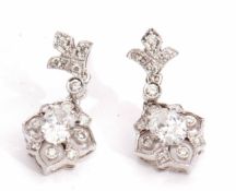 Pair of precious metal and diamond cluster drop earrings, the centre diamond of oval shape, 0.20ct