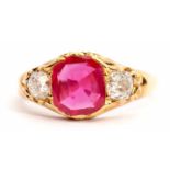 Ruby and diamond ring, the oval shaped ruby 0.83ct approx, flanked by two old cushion cut