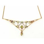 Early 20th century peridot and seed pearl articulated necklace, a spider's web design set with
