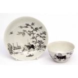 Worcester tea bowl and saucer circa 1756-58 with black pencilled decoration of the boy on a