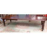 19th century mahogany wind-out extending dining table, the plain top with moulded edge and fitted