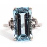 Precious metal aquamarine and diamond ring, the step-cut aquamarine set in a four-claw mount,