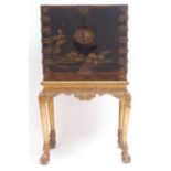 Oriental lacquered and japanned cabinet on stand, two doors enclosing a fitted interior of drawers