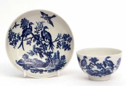 18th century Worcester tea bowl and saucer circa 1770, decorated in underglaze blue with bird in
