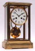 Early 20th century French lacquered brass four glass mantel clock, the plinth shaped case with