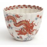 Chelsea fluted beaker decorated in the Kakiemon palette with a celestial dragon entwined around