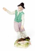 Mid-18th century meissen model of a Dutch fisherman designed by P Reinicke, the figure stands with