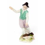 Mid-18th century meissen model of a Dutch fisherman designed by P Reinicke, the figure stands with