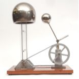 Early 20th century mahogany mounted cast steel Perspex stainless steel and aluminium Van de Graff