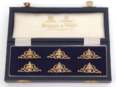 Cased set of six Elizabeth II silver gilt place card holders, each of cast and pierced scrolling