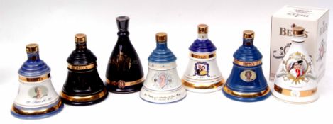 Seven various Wade porcelain Bell's Whisky Royal Commemorative decanters, includes 2001 75th