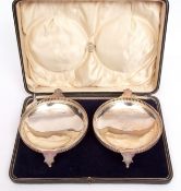 Cased pair of George V shallow footed bowls, each of polished circular form with pierced galleries