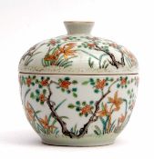 Chinese porcelain enamelled bowl with prunus and flowering plants in a famille vert and gilt design,