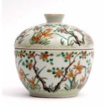 Chinese porcelain enamelled bowl with prunus and flowering plants in a famille vert and gilt design,