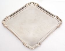 George VI square silver tray with shaped corners and polished field, width 37cm, weight approx