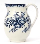 Lowestoft milk jug decorated in Worcester style with a flower head and trailing flowers below a