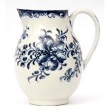 Lowestoft milk jug decorated in Worcester style with a flower head and trailing flowers below a