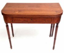 Early 19th century mahogany card table, folding top and reeded edge over a frieze with central