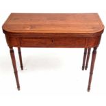 Early 19th century mahogany card table, folding top and reeded edge over a frieze with central