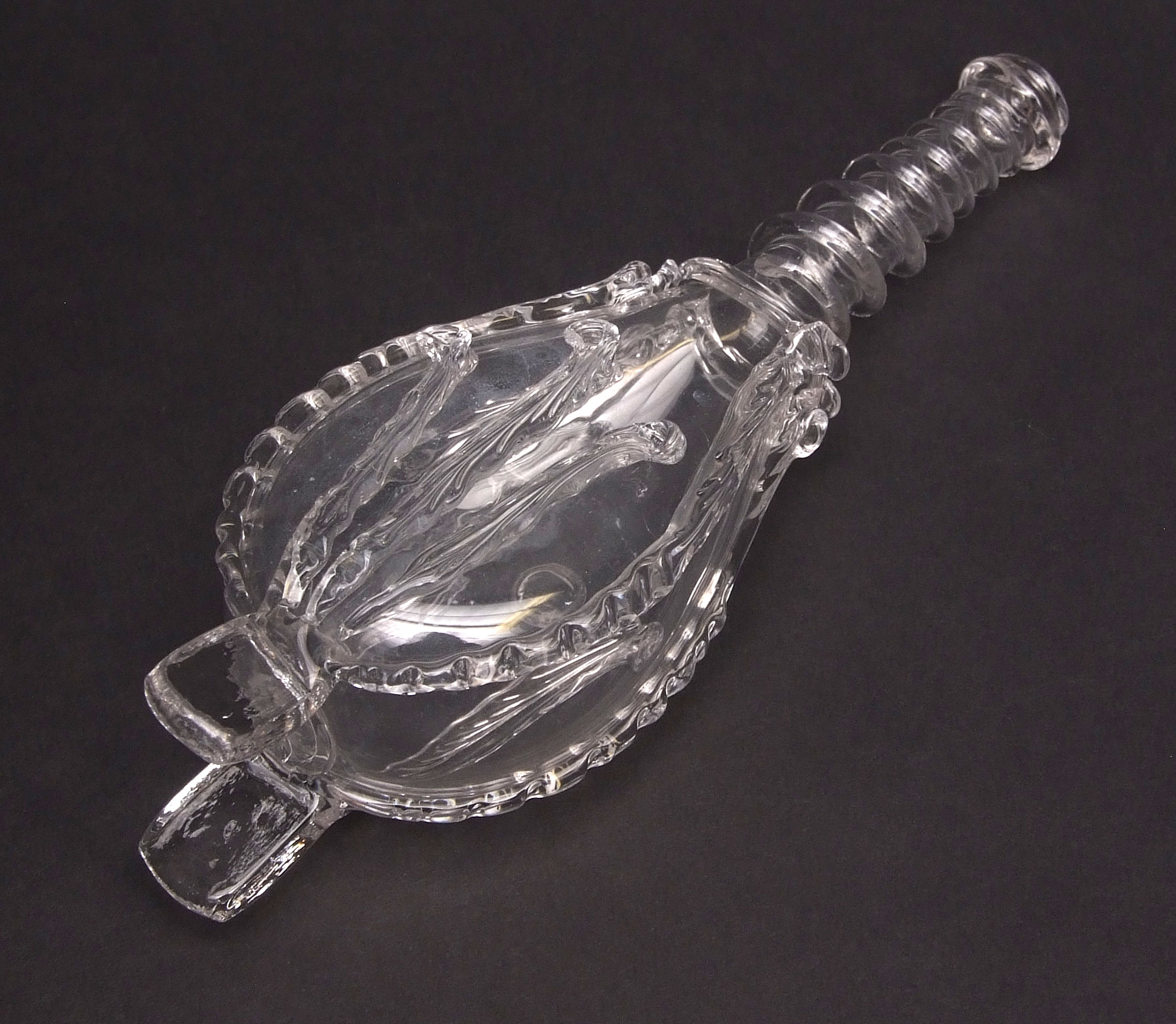 Novelty glass frigger in the form of a pair of bellows, spiral twist neck, the body moulded with