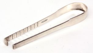 Pair of George III Scottish Fiddle pattern chop tongs of plain polished form, length 25cm, weight