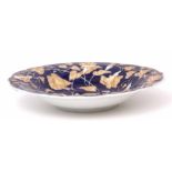 19th century Meissen dish, the blue ground with moulded floral design, the flowers picked out in