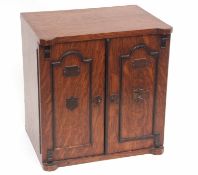 Late 19th century oak smoker's cabinet, the two panelled front doors with plaques bearing the