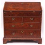 Early 18th century walnut bureau, fall front enclosing a fitted interior of drawers, pigeonholes and