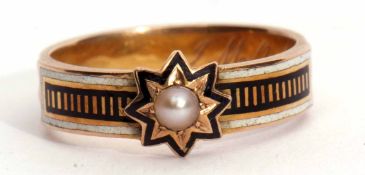 Victorian Memoriam ring featuring a small seed pearl in a star engraved black enamel setting,