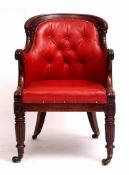 Late Regency period mahogany desk chair, arched back and slightly splayed arms terminating in