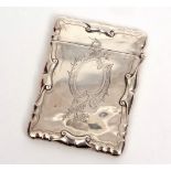 Edward VII card case of hinged rectangular form with C-scroll borders and engraved body with