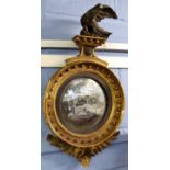 Victorian parcel gilded and ebonised girandole, crested with a bird of prey and with ball moulded