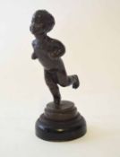 20th century patinated brass model of a running child on a stepped circular socle, height 13cm