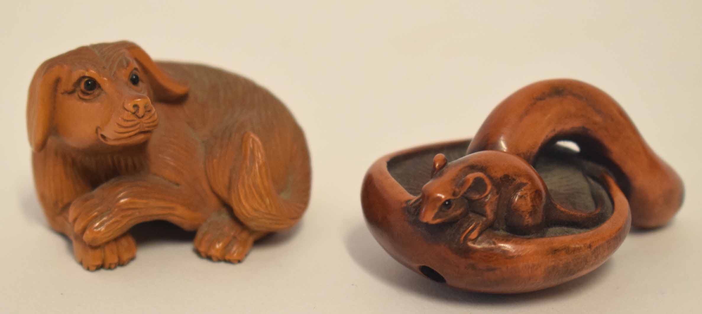 Group of two wooden netsuke or toggles, one modelled as a dog, the other as a mouse on a mushroom